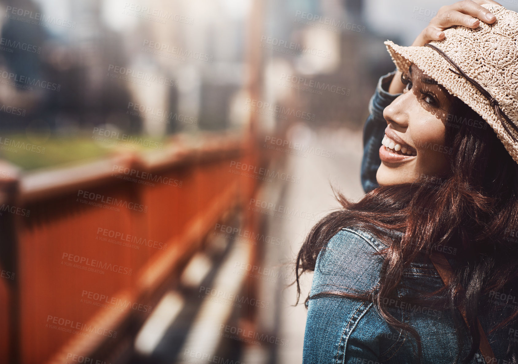 Buy stock photo Shot of a beautiful young woman spending her day in the city