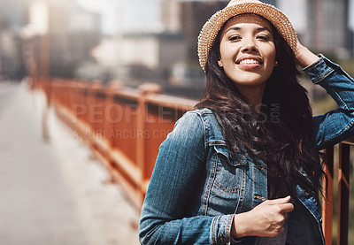 Buy stock photo Shot of a beautiful young woman spending her day in the city
