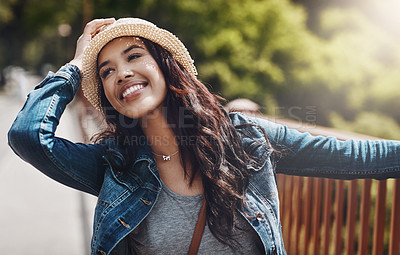 Buy stock photo Shot of a playful young woman spending the day outdoors