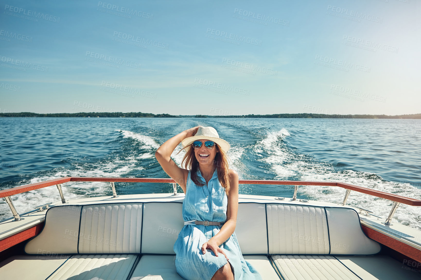 Buy stock photo Relax, travel or happy woman on boat on ocean for outdoor vacation or holiday on summer adventure. Cruise, tourist and person with smile, fashion or hat on yacht on sea for weekend trip in Greece