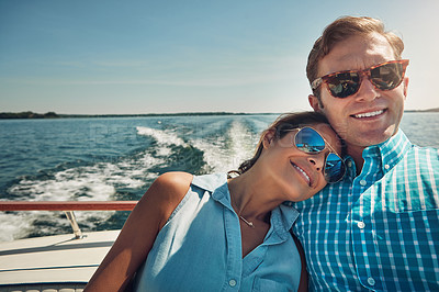 Buy stock photo Shot of a young couple spending time together on a yacht