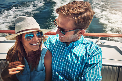 Buy stock photo Shot of a young couple spending time together on a yacht