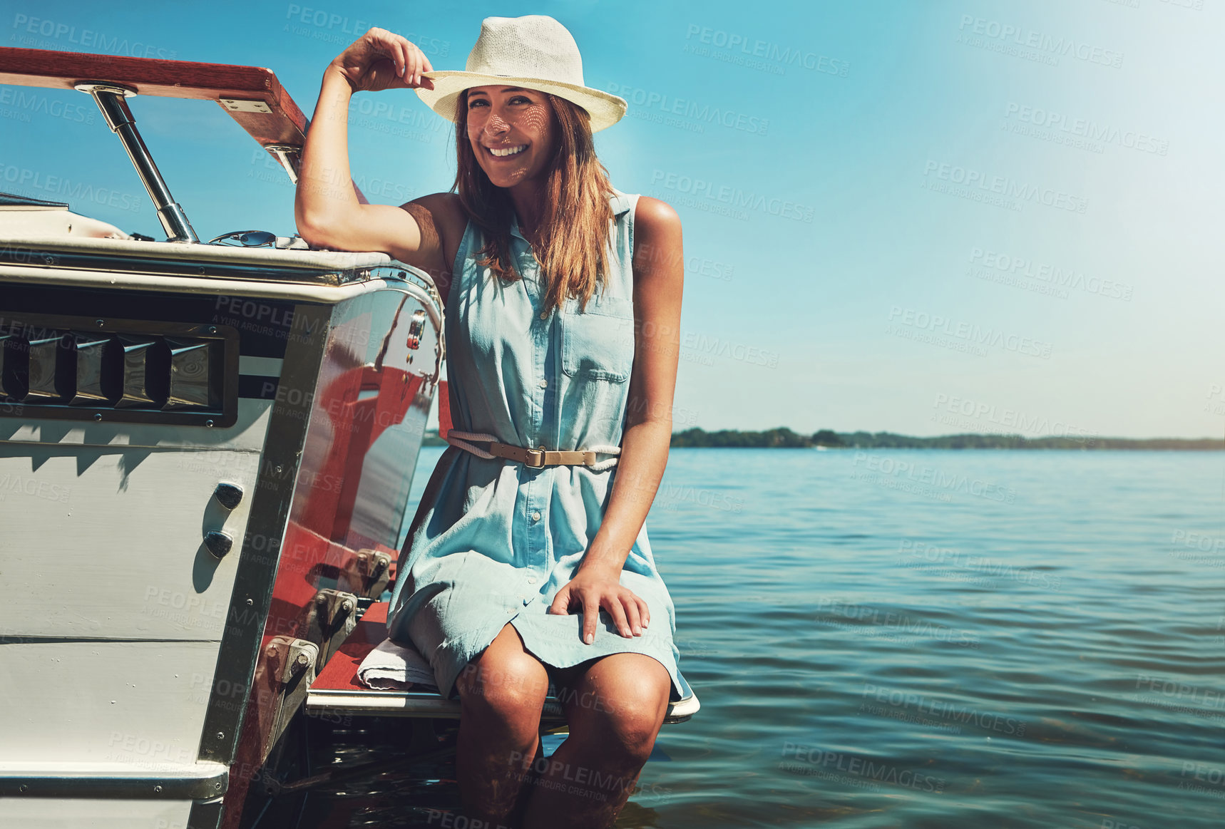 Buy stock photo Portrait of an attractive young woman spending the day on her private yacht
