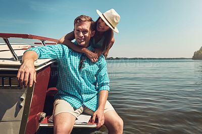 Buy stock photo Portrait of a young couple spending time together on a yacht