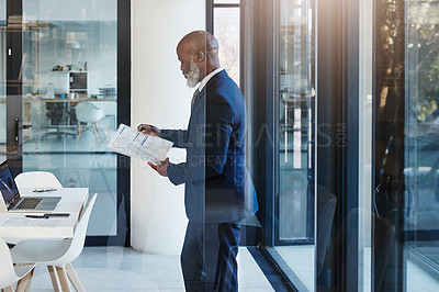 Buy stock photo Cropped shot of a mature businessman working in a modern office