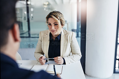 Buy stock photo Shot of businesspeople having a meeting in an office