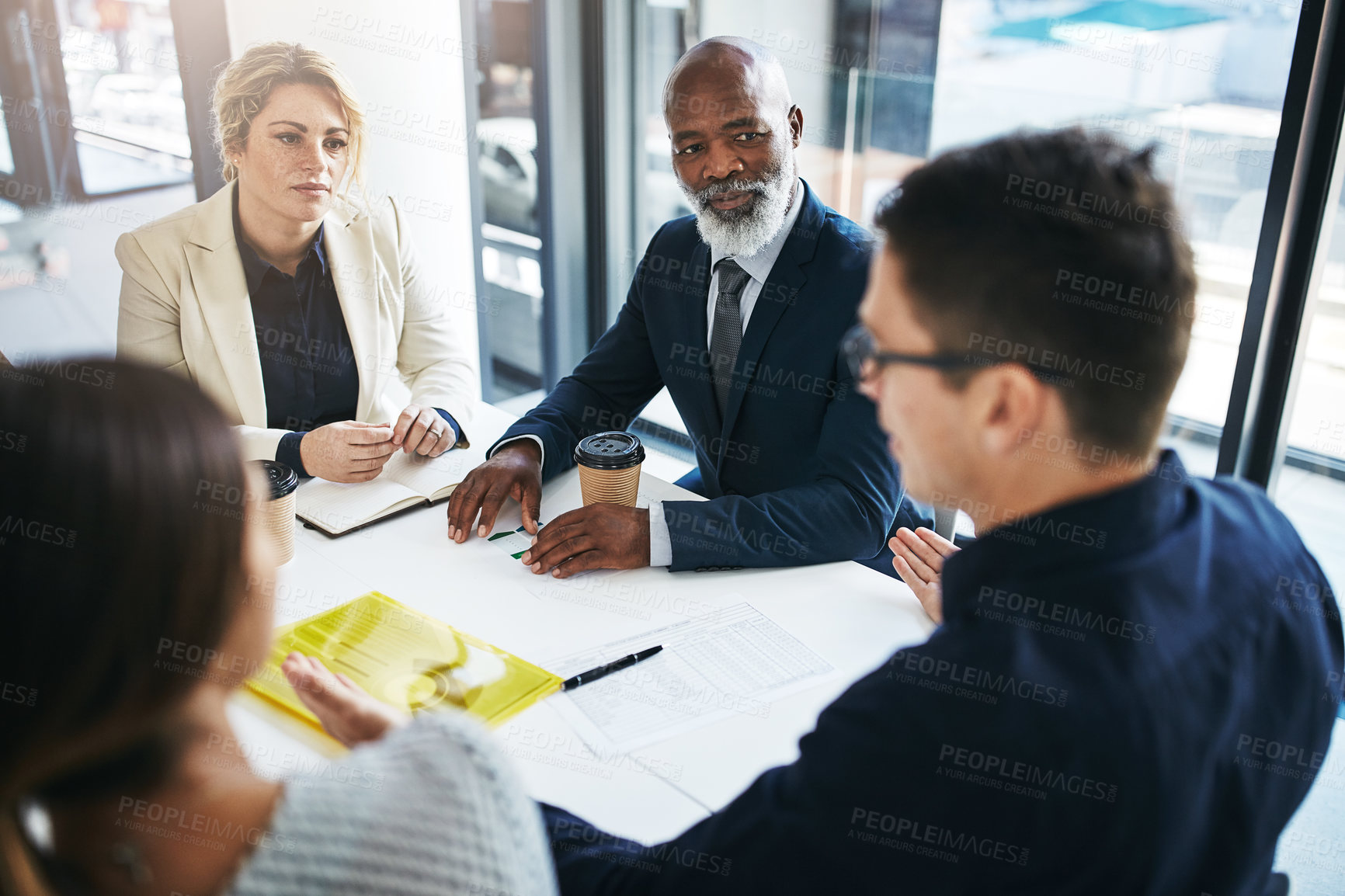 Buy stock photo Business people, meeting and team discussion for strategy, marketing or collaboration at the office. Group of employee workers in business meeting, teamwork or coaching for sales at the workplace