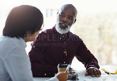 Buy stock photo Shot of two businessmen having a discussion in an office