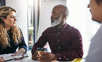 Buy stock photo Shot of a group of businesspeople having a meeting in an office