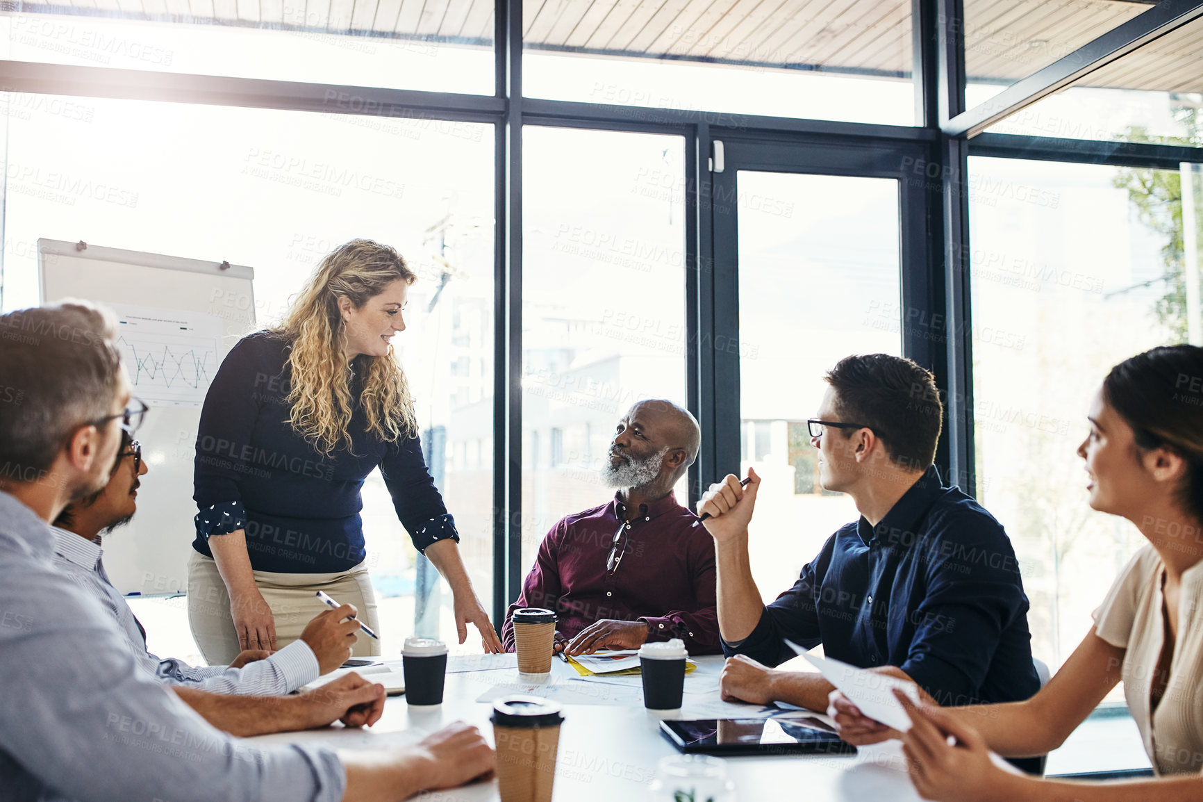 Buy stock photo Shot of a businesswoman giving a presentation to her colleagues in an office