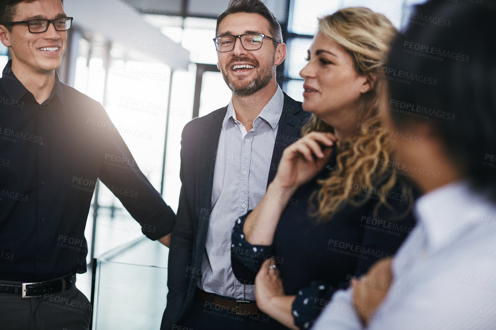 Buy stock photo Shot of a group of businesspeople having a discussion in an office