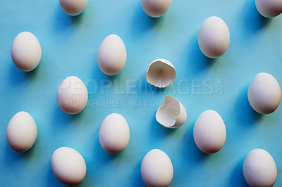 Buy stock photo Eggs, crack and bunch above with blue background for breakfast, cooking or protein nutrition. Top view, organic and chicken produce with open shell or food for production, agriculture or fresh stock