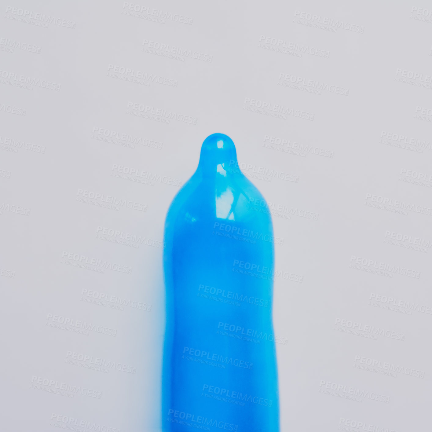 Buy stock photo Blue, condom or latex in studio for education, sexual health or STD awareness. Contraception, safety or responsibility on gray background for creativity, HIV prevention or rubber for protection