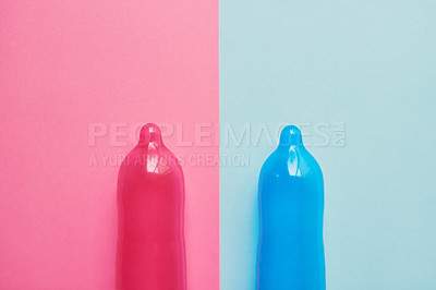 Buy stock photo Colorful, condoms or wellness with latex for education, sexual health or STD awareness. Contraception, safety or responsible on studio background for HIV prevention, creative or rubber for protection