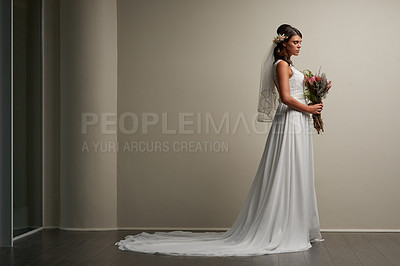 Buy stock photo Studio shot of a young beautiful bride posing against a grey background