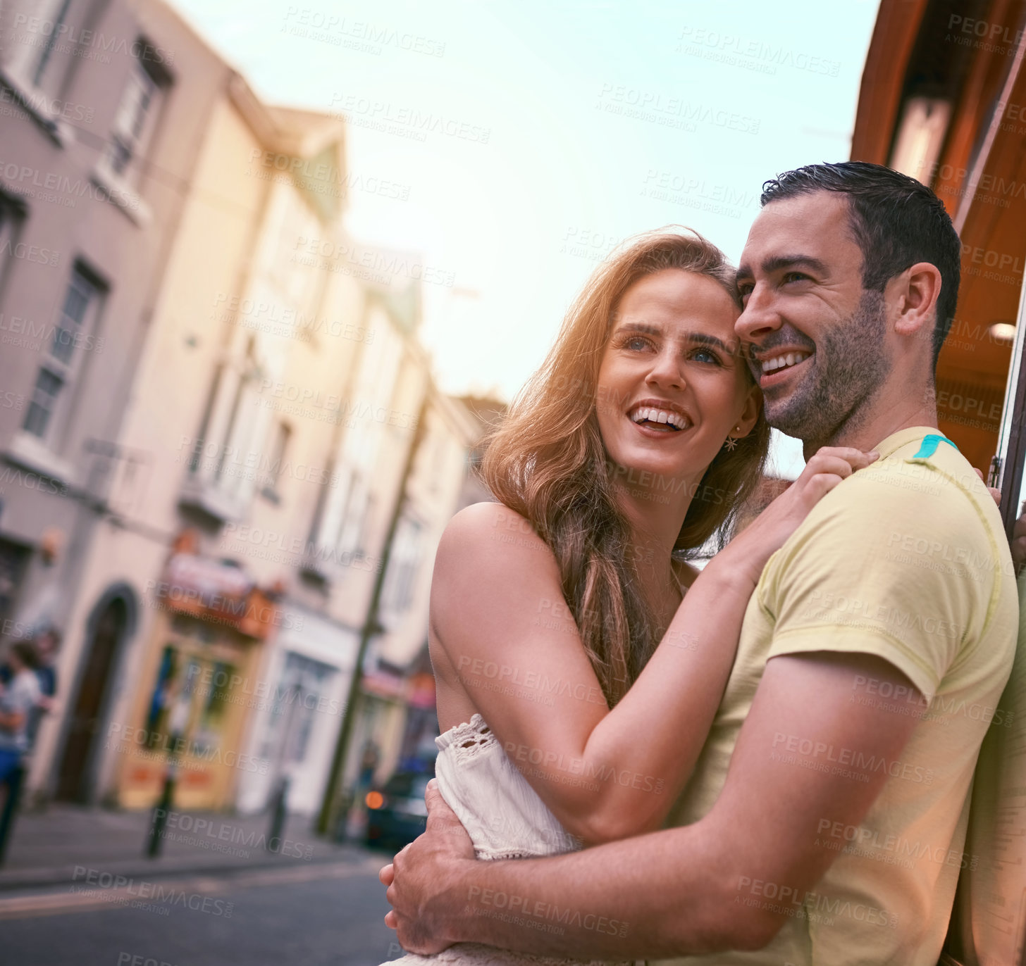 Buy stock photo Travel, couple and love with hug, smile and urban journey on holiday, adventure or honeymoon. Vacation, man and happy woman with romance in city for Europe, street tourism and sightseeing together