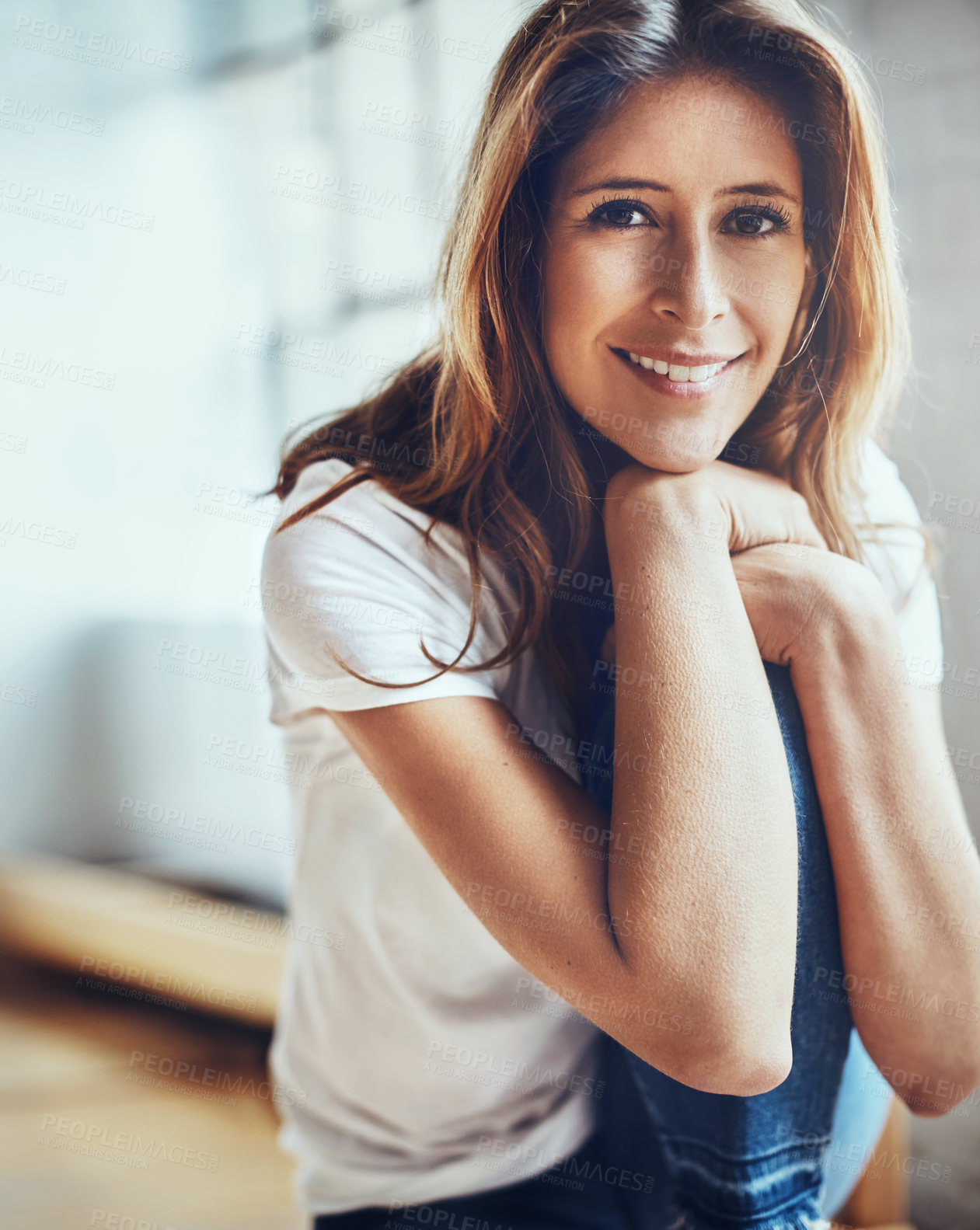 Buy stock photo Portrait of an attractive young woman relaxing at home