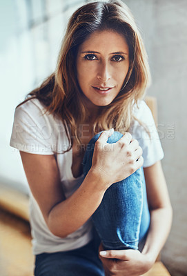 Buy stock photo Portrait of an attractive young woman relaxing at home