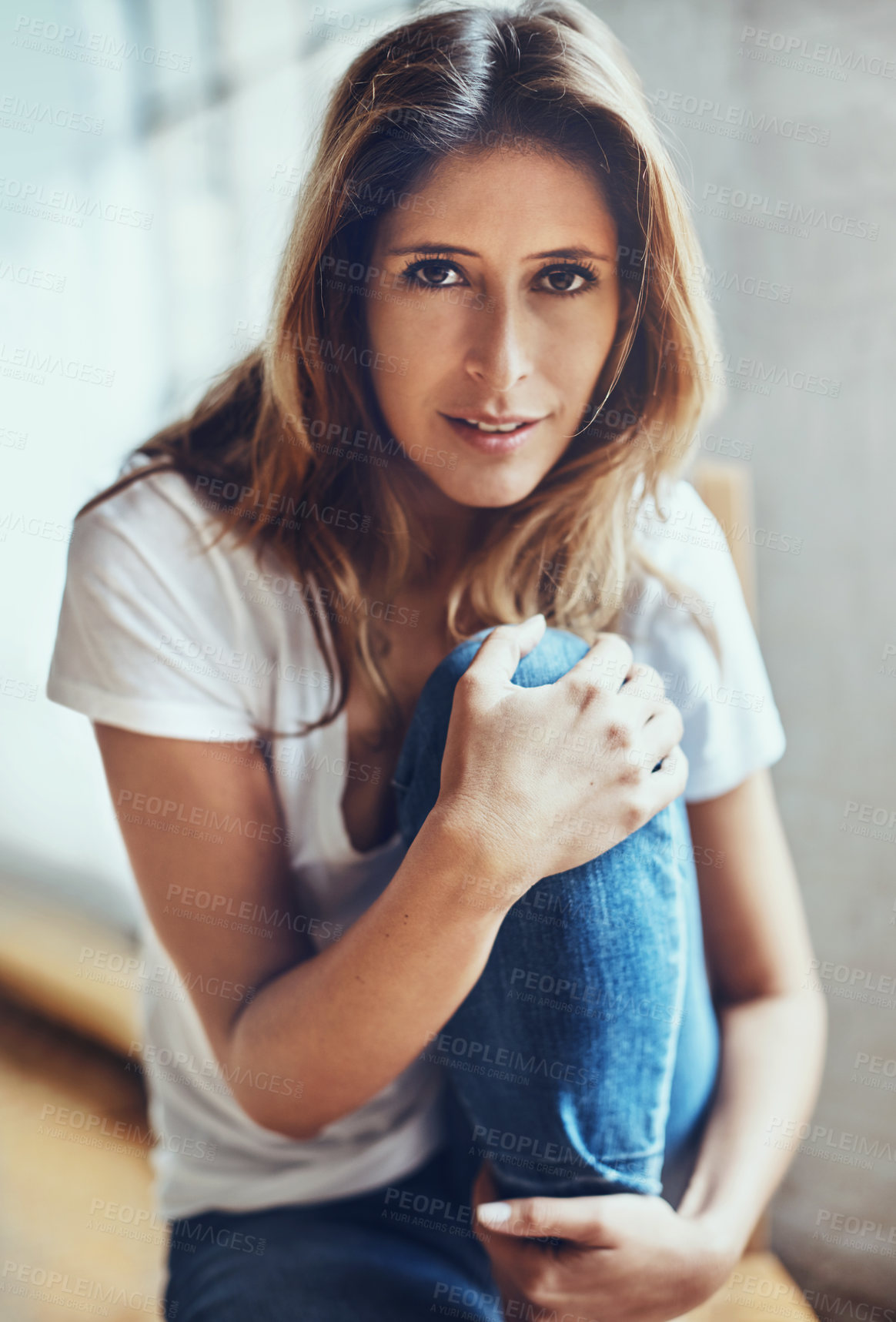 Buy stock photo Portrait of an attractive young woman relaxing at home