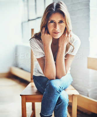 Buy stock photo Portrait of an attractive young woman relaxing at home