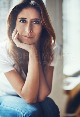 Buy stock photo Portrait of an attractive young woman relaxing at home