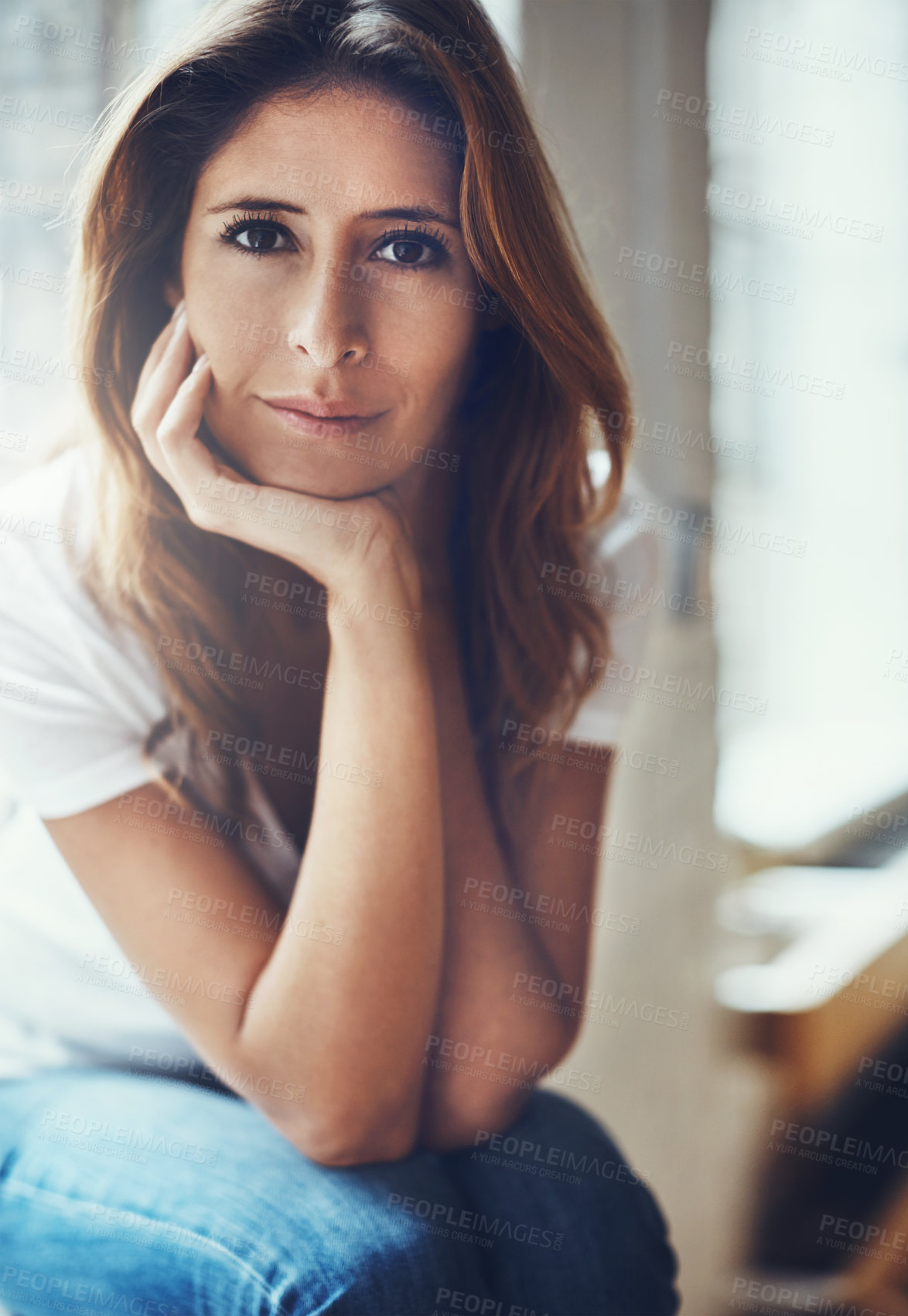 Buy stock photo Portrait of an attractive young woman relaxing at home