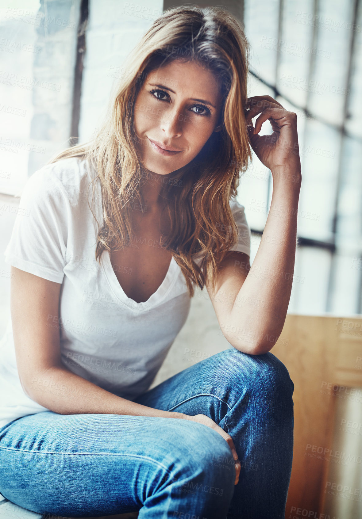 Buy stock photo Portrait of an attractive young woman relaxing at home