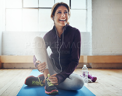 Buy stock photo Fitness, music and stretching with a woman in her home, happy while sitting on an exercise mat. Workout, thinking and warm up with a happy young female athlete training for health or wellness