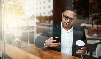 Buy stock photo Coffee shop, business and man with smartphone, typing and texting contact for schedule and deadline. Person, employee and entrepreneur with morning tea and espresso with cellphone to message client