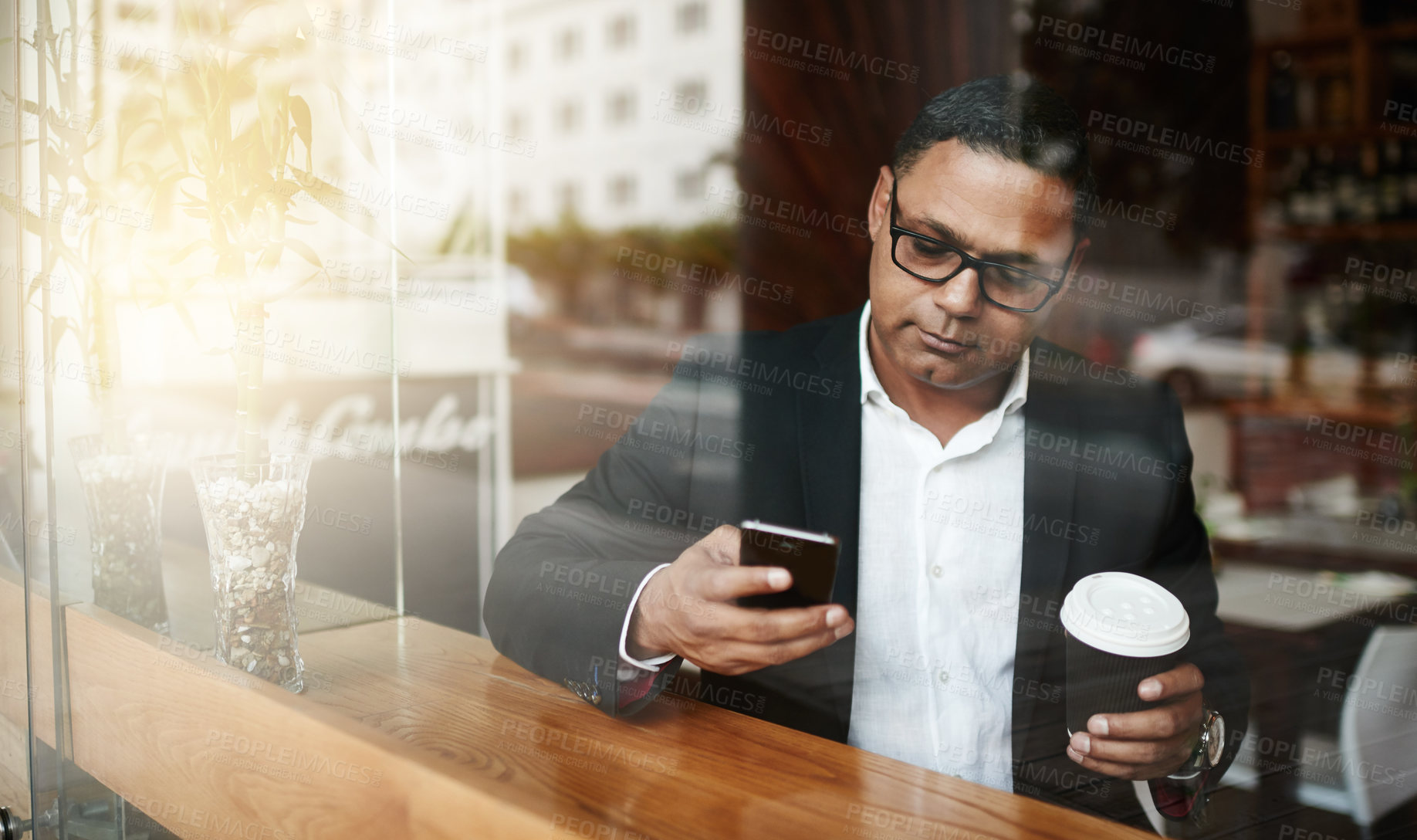 Buy stock photo Coffee shop, business and man with smartphone, typing and texting contact for schedule and deadline. Person, employee and entrepreneur with morning tea and espresso with cellphone to message client