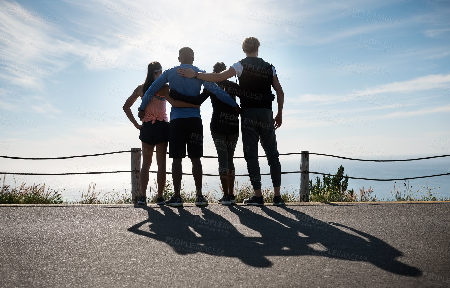 Buy stock photo Rearview shot of a fitness group admiring the view outdoors