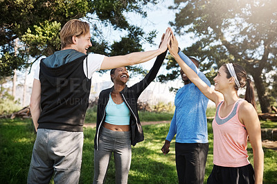 Buy stock photo Cropped shot of a fitness group high-fiving after a workout