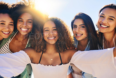 Buy stock photo Cropped shot of a group of girlfriends posing for a selfie outdoors