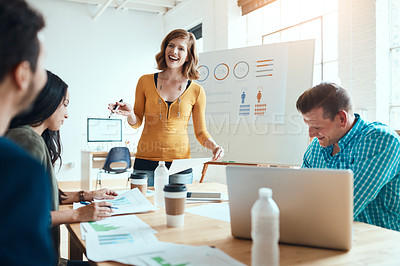 Buy stock photo Shot of a group of young businesspeople having a meeting in a modern office