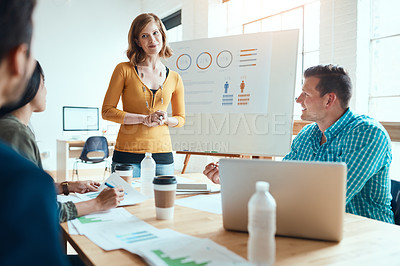 Buy stock photo Shot of a group of young businesspeople having a meeting in a modern office