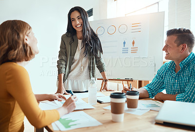 Buy stock photo Shot of a group of young businesspeople having a meeting in a modern office