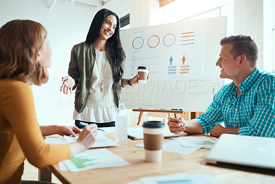 Buy stock photo Shot of a group of young businesspeople having a meeting in a modern office