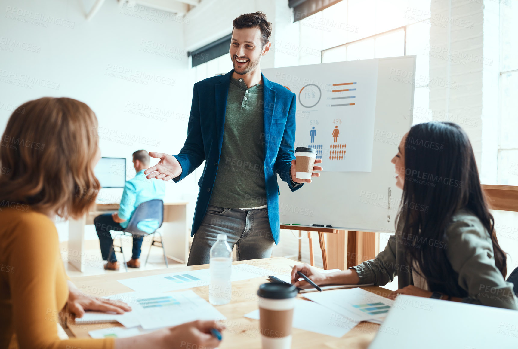 Buy stock photo Shot of a group of young businesspeople having a meeting in a modern office