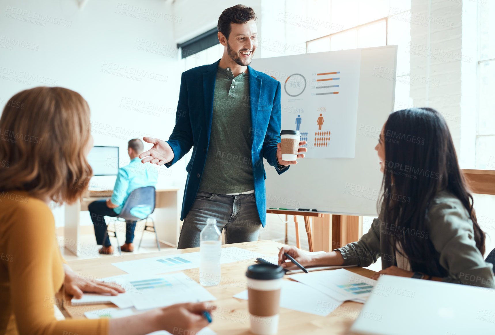 Buy stock photo Shot of a group of young businesspeople having a meeting in a modern office