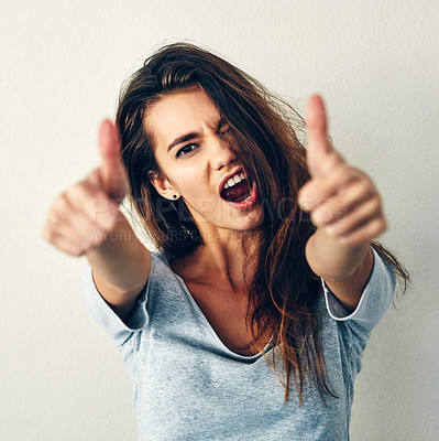 Buy stock photo Woman, energy and portrait thumbs up for fashion in white background for makeover, style and casual wear. Female person, girl and gen z in confidence or satisfied with yes, agree and approval