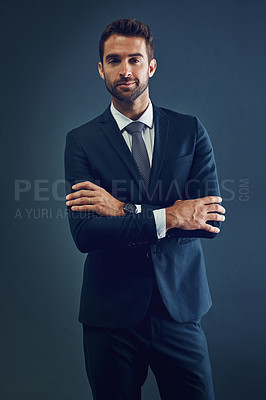 Buy stock photo Studio, business and portrait of man with confidence, designer style and dark aesthetic. Corporate fashion, gentleman and serious businessman with professional pride, luxury suit and blue background