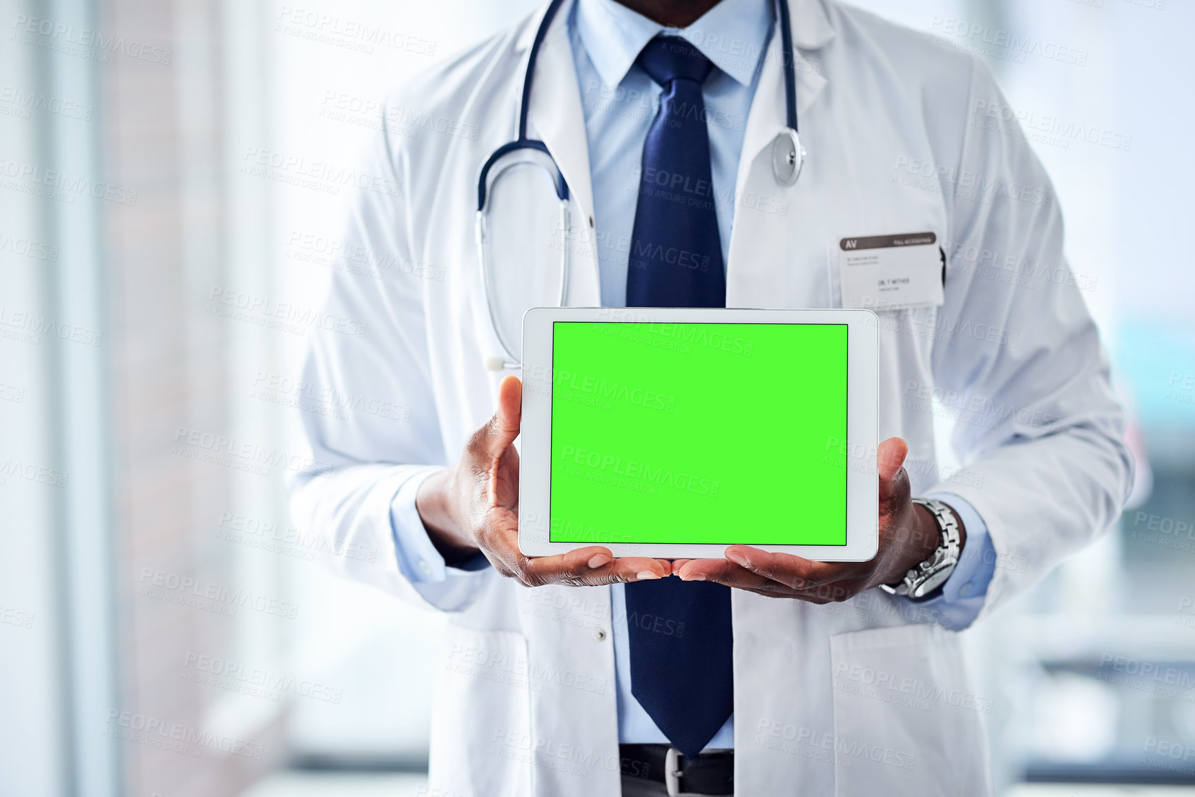 Buy stock photo Green screen, tablet and hands of doctor at hospital with mockup for healthcare, help or questions. Digital, space and man surgeon at clinic with how to, steps or Telehealth consulting app sign up