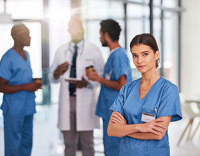 Buy stock photo Arms crossed, healthcare and portrait of nurse in hospital with team for service you can trust. Integrity, medical and proud with serious medicine professional woman in clinic for cardiology