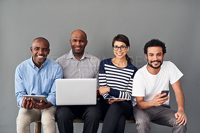 Buy stock photo Creative, business people and tech at wall for portrait, design process and startup team. Happy woman, men and smile at gray background for project opportunity, creativity and connectivity for growth