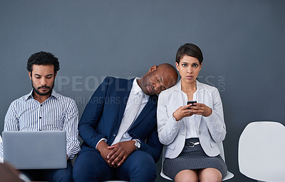Buy stock photo Studio shot of corporate businesspeople waiting in line against a gray background
