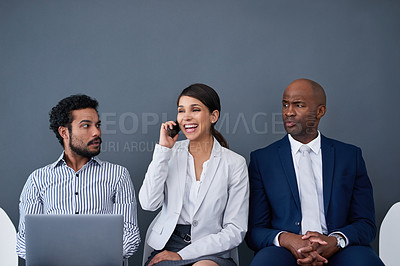 Buy stock photo Studio shot of corporate businesspeople waiting in line against a gray background