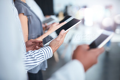 Buy stock photo Cropped shot of unrecognizable corporate businesspeople using different devices in an office