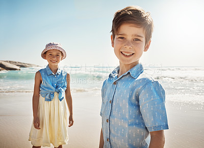 Buy stock photo Portrait of two adorable little children playing at the beach