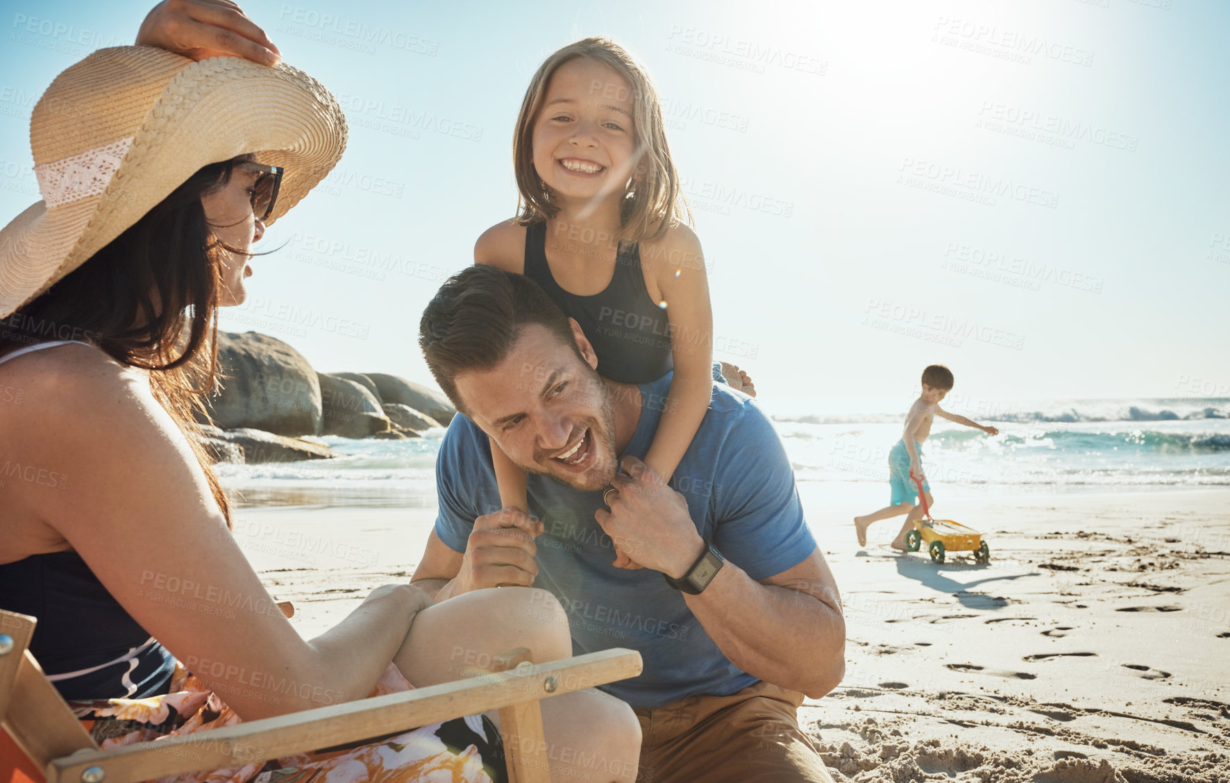 Buy stock photo Parents, girl and piggy back at beach, vacation and portrait in summer, excited and happy for bonding. Father, mother and children with family, holiday and care with love in sunshine by sea in Miami