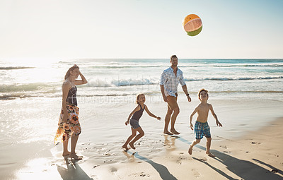 Buy stock photo Shot of a family of four spending the day at the beach